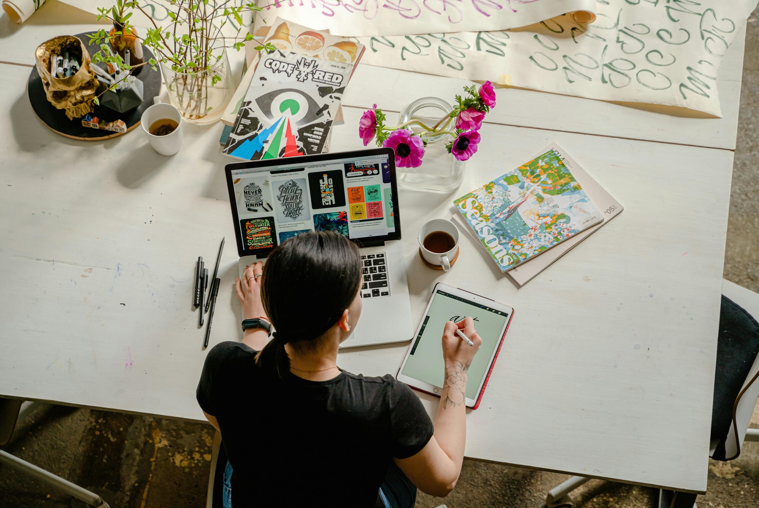 Illustration showing overwhelmed worker swamped by scattered emails on desk