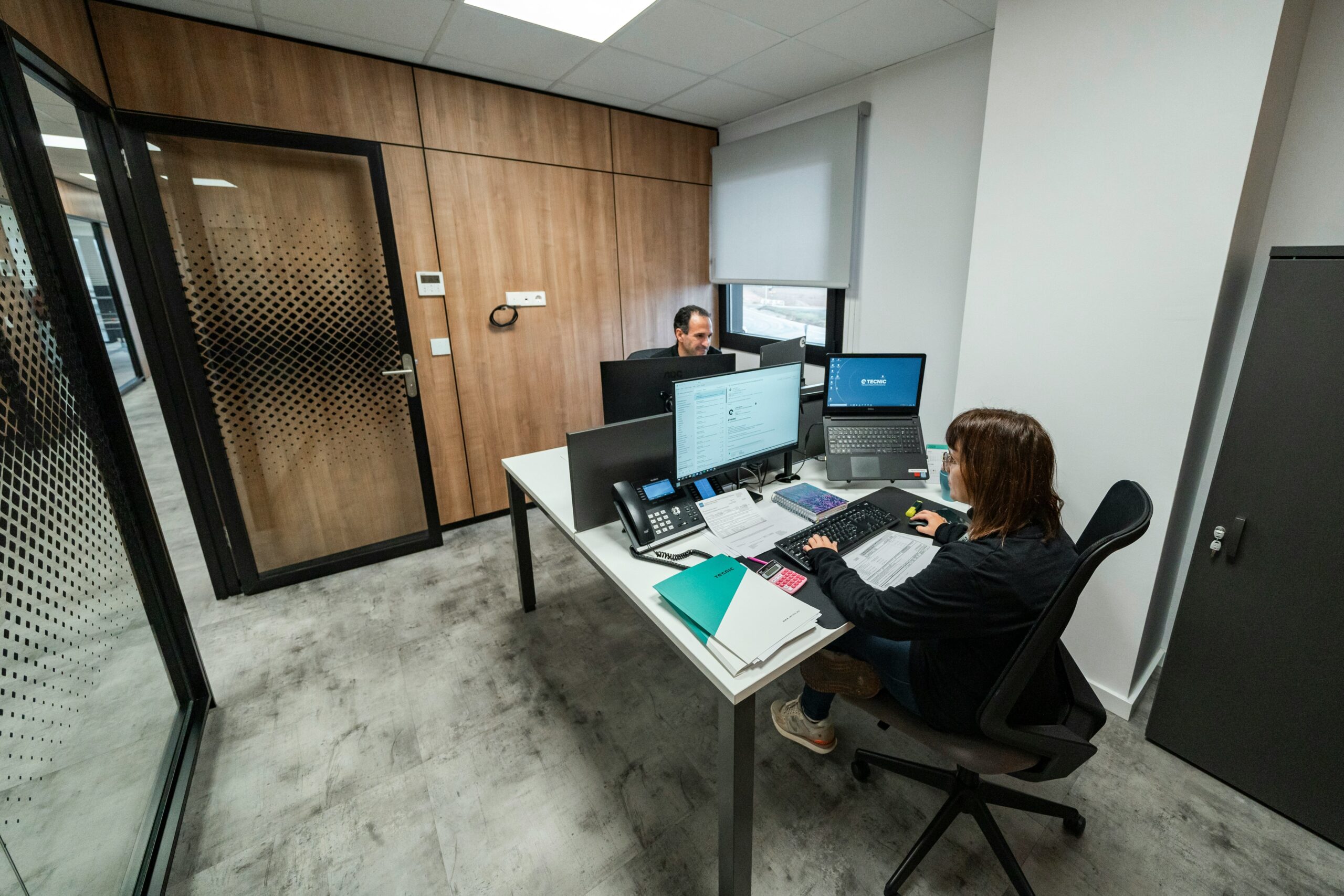 A busy call center filled with agents wearing headsets