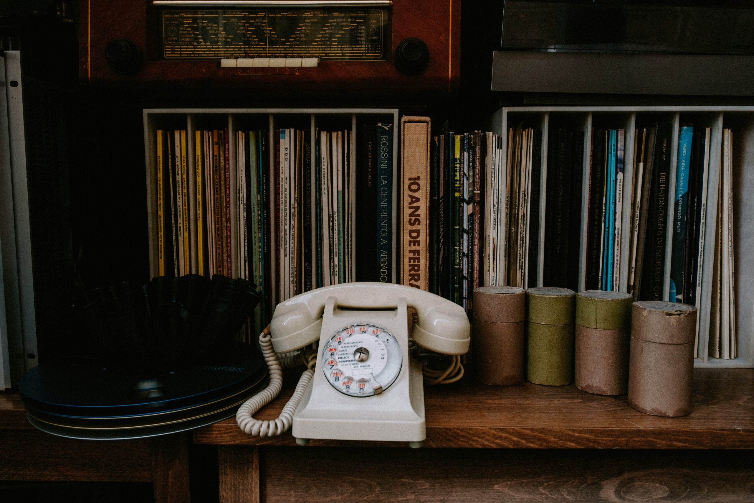 An old rotary phone sitting on a desk symbolizing inefficiency